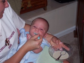 Mon Aug 29 20:12:22 2005

Andrew had his 4-month pediatric visit today where he received his 4-month immunization injections.  He weighed 15 lbs. and 2 oz. today, and also took his first food with a spoon -- ground rice mixed with baby formula.