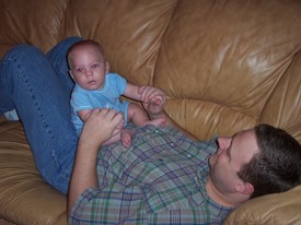 Wed Oct  5 19:30:57 2005

Dad and I play twice each day --in the morning before, and in the afternoon after, he goes to work.  This shot is after work...  Mom's probably in the kitchen wrapping up some 