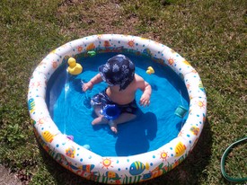 Wed Feb 22 13:38:01 2006

On a couple of warm February days, Mom and Andrew played in the kiddie pool.