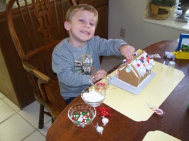 Mon 22 Dec 2008 03:07:34 PM

Andrew and Mom decorated the gingerbread house from Breland and Vana.