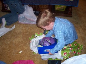 Sat 07 Feb 2009 09:41:12 PM

Andrew _finally_ got to open the Christmas presents that were sitting under the tree at Grandmother and Granddaddy's house for several extra weeks...