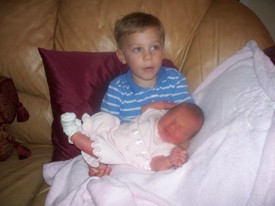 Thu 26 Mar 2009 07:13 PM

Andrew holds Gracie for the first time.