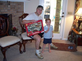 Sat 25 Apr 2009 10:25:31 AM

Ellen promised Andrew that he could open gifts from us (mom and dad) in the AM before his afternoon party.  She'd not planned for the fact that there was yard work to do before the party ... so, dad had to stop long enough for the gifts to be opened.