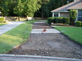 Tue 02 Jun 2009 07:07:20 PM

Andrew plays while dad inspects and photos the work being done on the driveway.