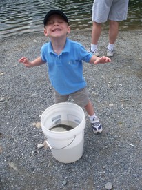 Tue 28 Jul 2009 11:38:03 AM

Andrew poses after helping net the first fish.