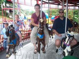 Thu 30 Jul 2009 12:12:03 PM

Andrew, mom, and dad on the carousel.