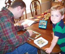 Sun 28 Mar 2010 11:51:24 AM

Dad and Andrew work on a new puzzle that Aunt Renee' gave to Andrew -- 100 pieces!