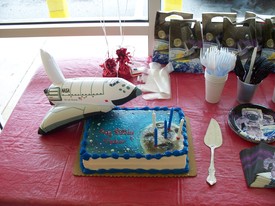 Sat 24 Apr 2010 12:02:21 PM

Andrew's party was space themed with an inflatable space shuttle and the candles stuck in the moon on the cake.