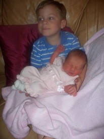 Thu 26 Mar 2009 07:12:12 PM

Andrew holds Gracie for the first time.