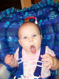 Sun 13 Sep 2009 06:54:52 PM

This is how Gracie tells us she wants another bite of baby food.  It's pretty funny to see and mom and Andrew call it Gracie's 